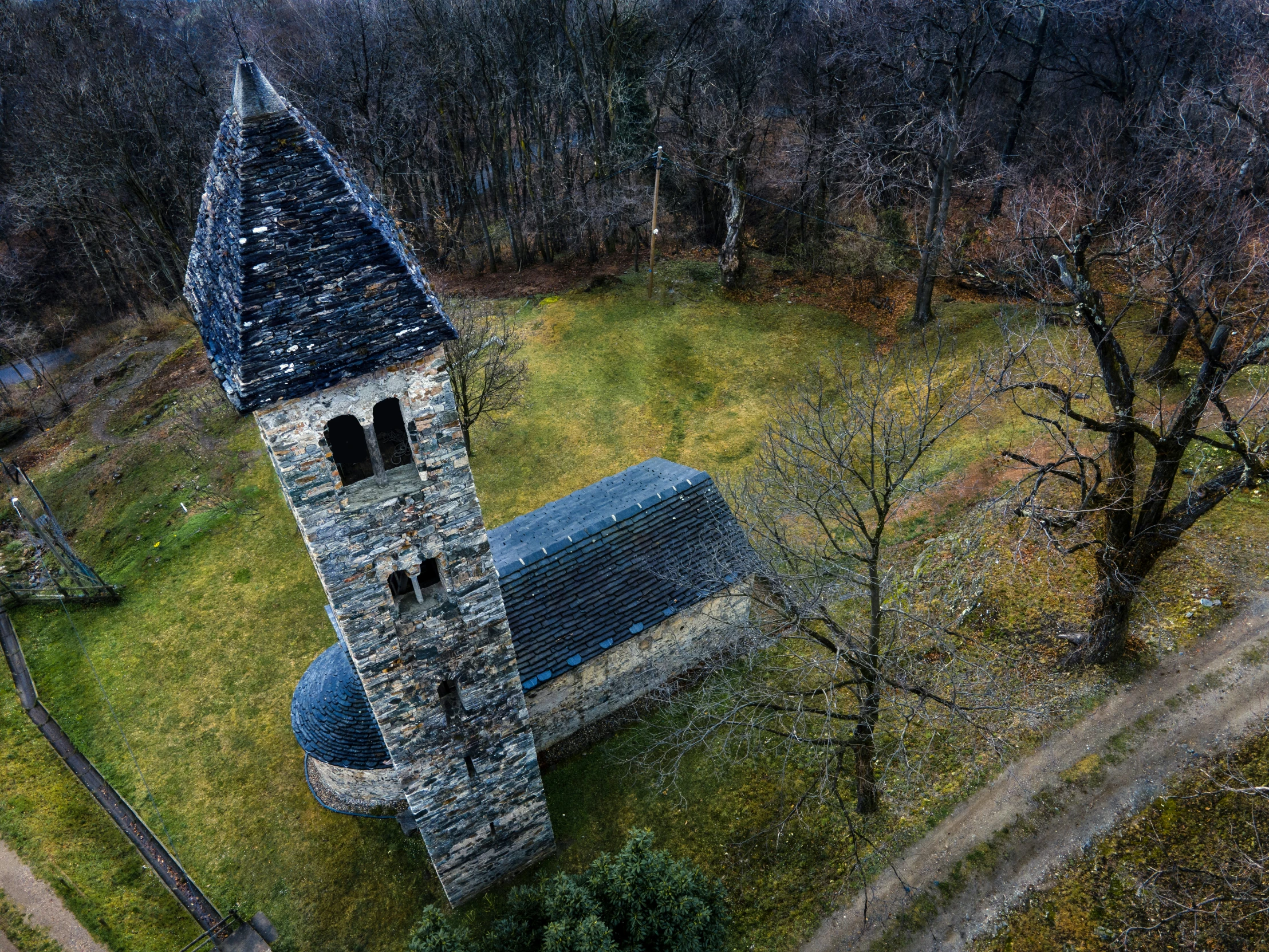 an aerial view of a gothic - styled church in the countryside