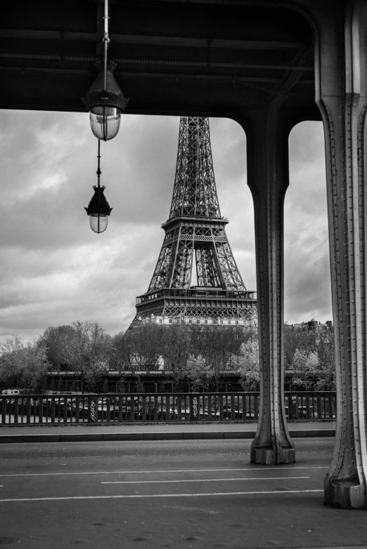 the eiffel tower from a distance with walkway in foreground