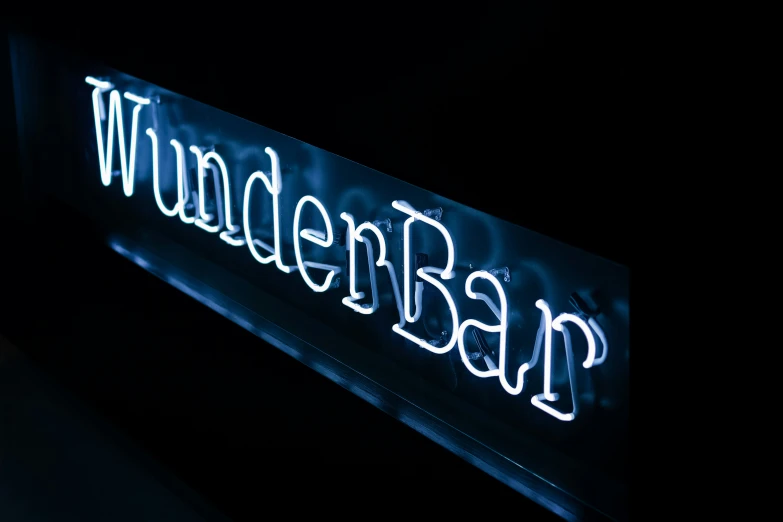 blue illuminated neon sign advertising a bar