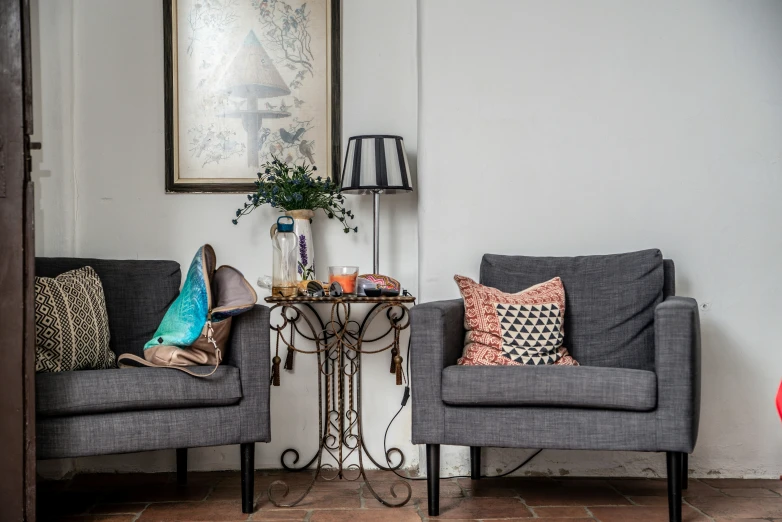 a living room area with two couches and one table