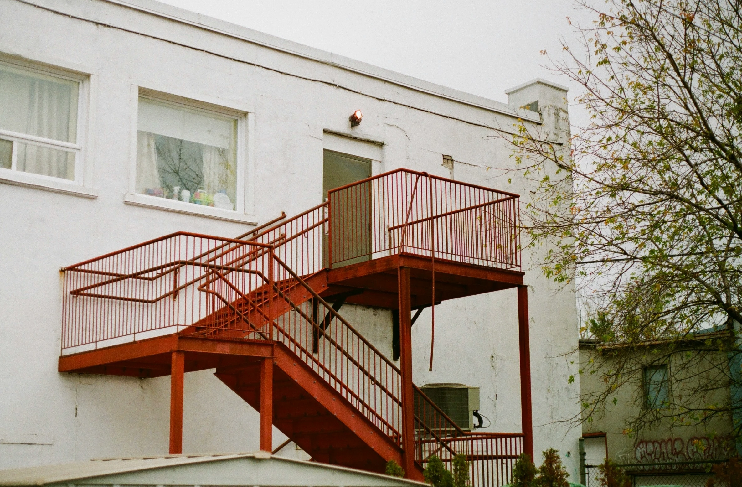 a fire escape system on a white building