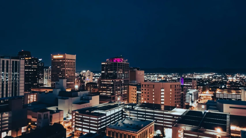 city skyline in the evening seen from a rooftop