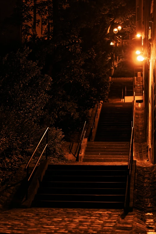 stairs illuminated by street lights in dark neighborhood