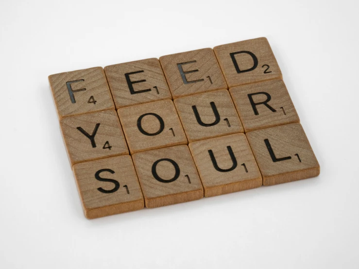 a piece of cardboard with words on it sitting next to a white table