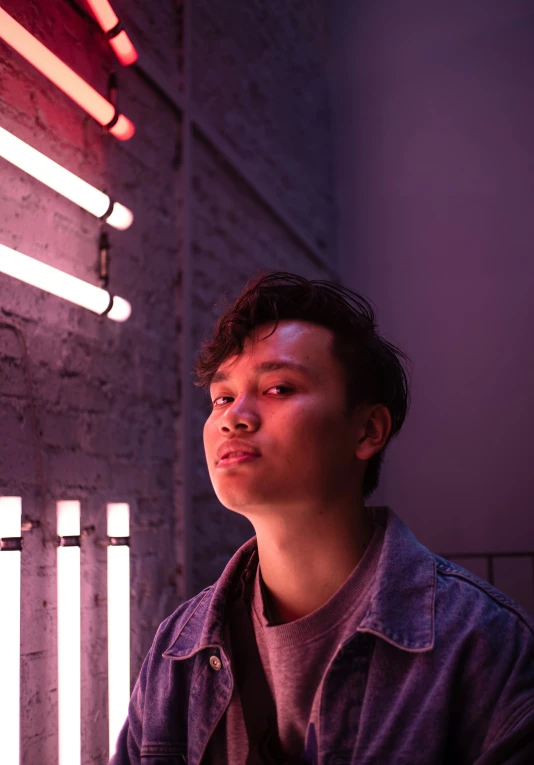 young man looking up at bright lights coming out from his ceiling