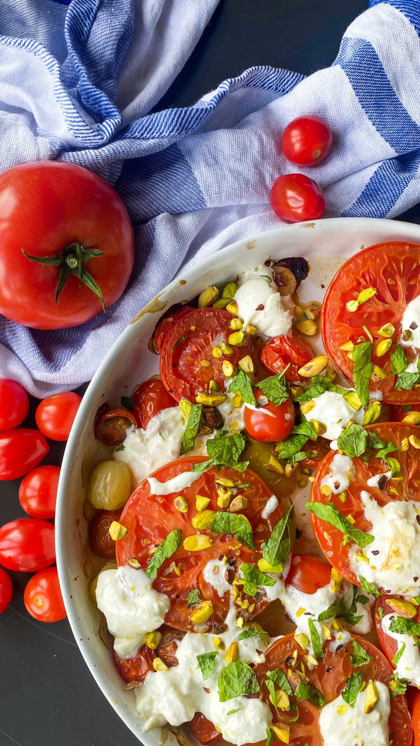 a bowl with cheese and tomatoes on it