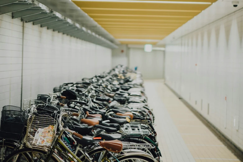 there are several rows of bicycles in the subway