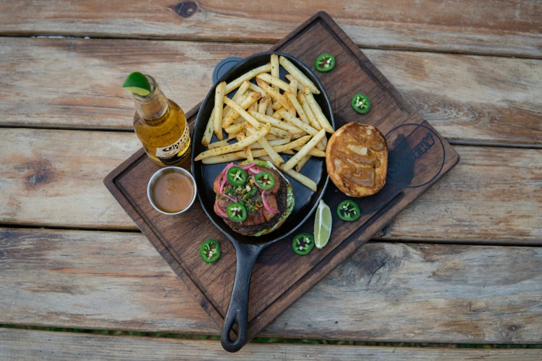 a dog in a pan with fries on a tray