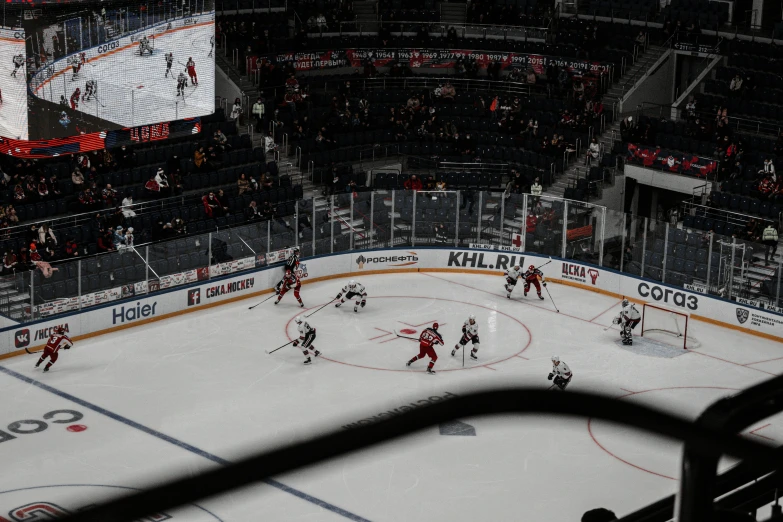 a hockey game in progress with many players playing