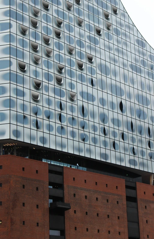 a large building that has windows and holes all over it