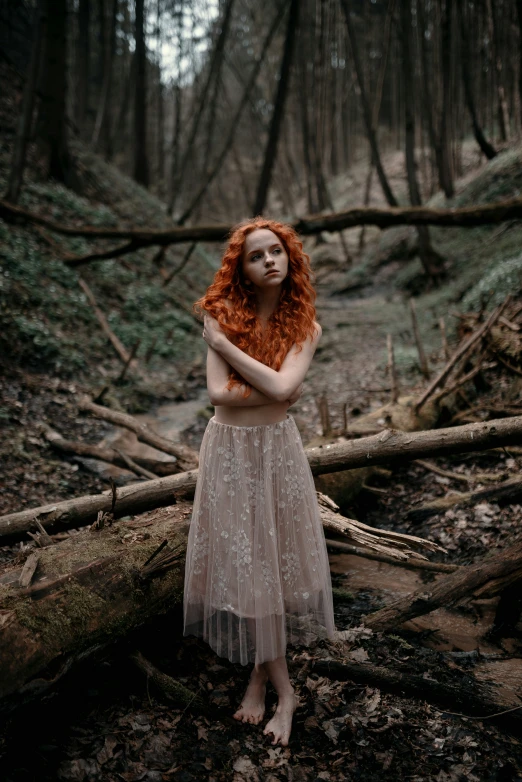 a woman wearing a skirt is posing for a po