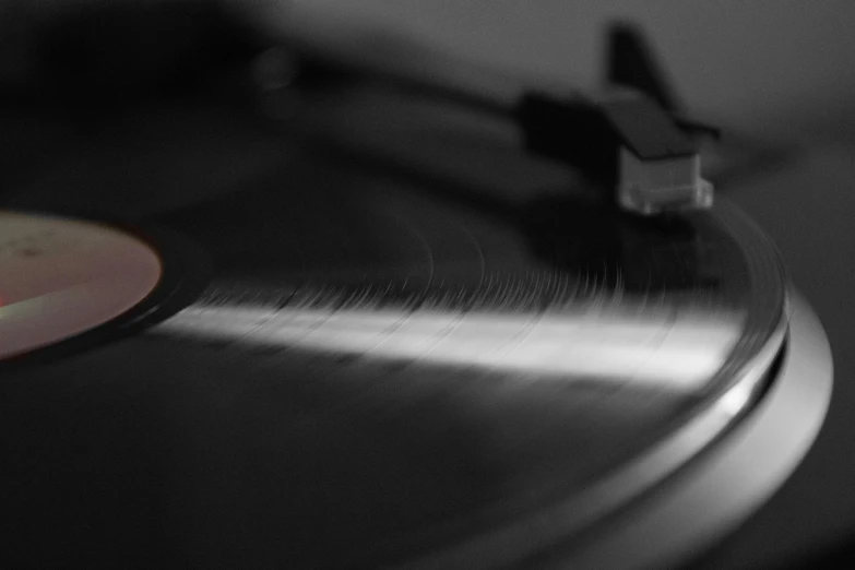 an old record player spinning it's vinyl disk