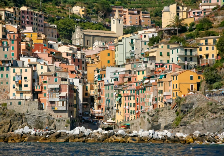 a hillside area in italy with a large city