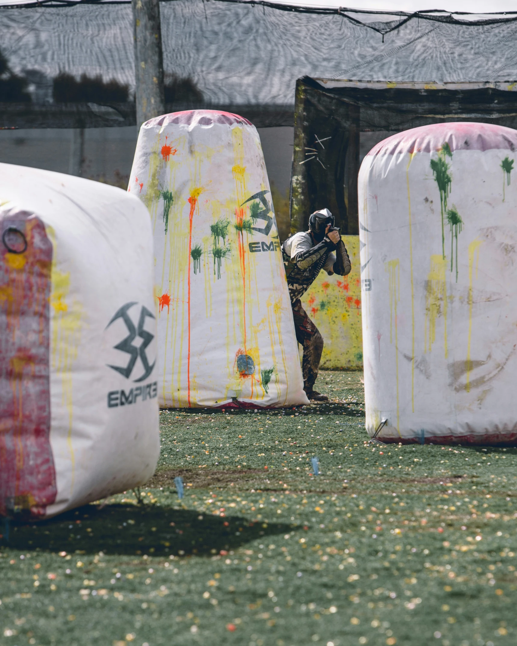 a man playing a game with a baseball bat on a field