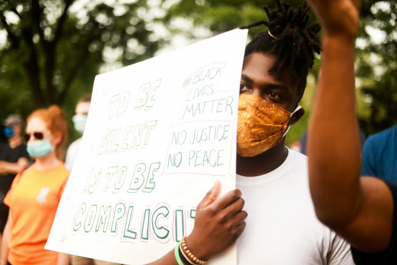 a person is holding up a sign with various words on it