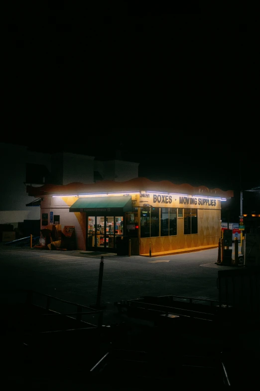 a store lit up at night and its lights are glowing