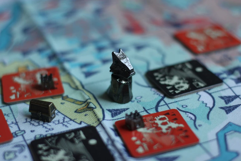 a close up of a monopoly board with playing pieces and dices