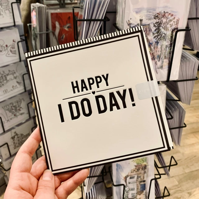 a card reads happy i do day on it