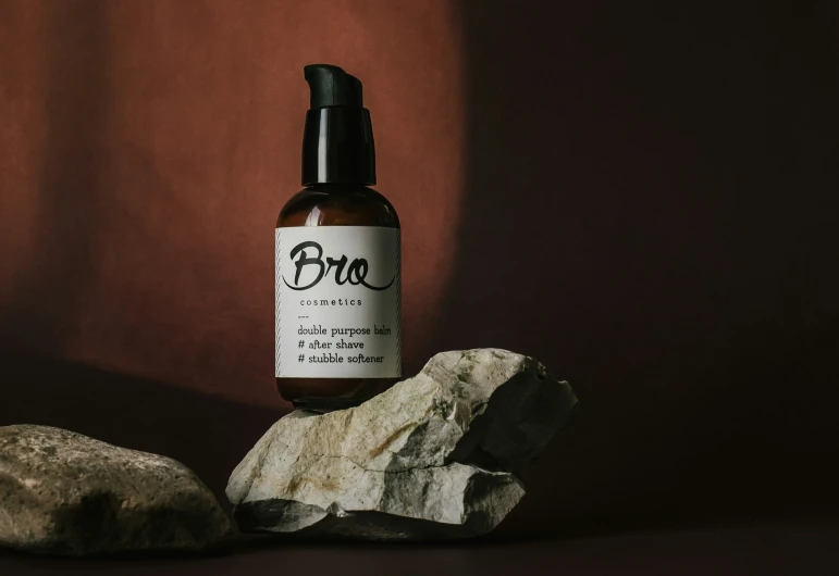 an image of a bottle of cbou product on rocks