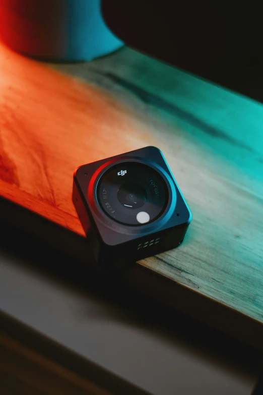 a black stereo on top of a wooden table