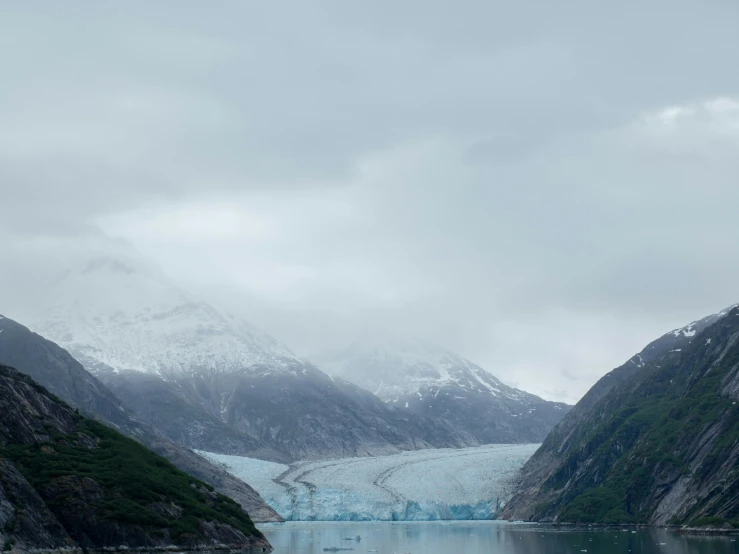 a glacier lake surrounded by a mountain range