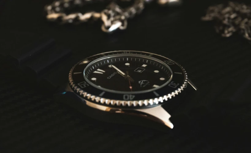 a watch that is on some kind of black background