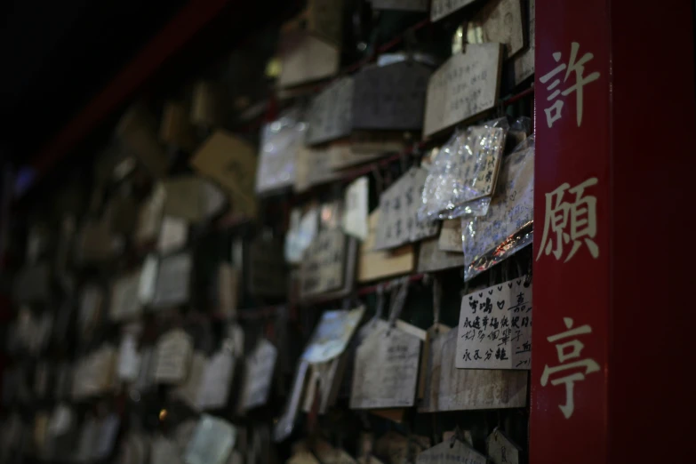 many types of paper and cards attached to a wall