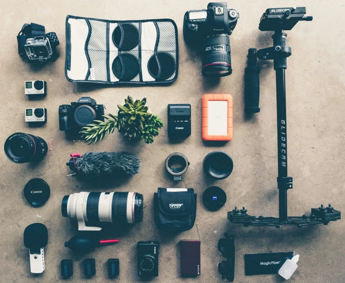 a group of different camera accessories and a camera