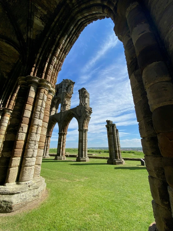 a building that has several stone pillars inside