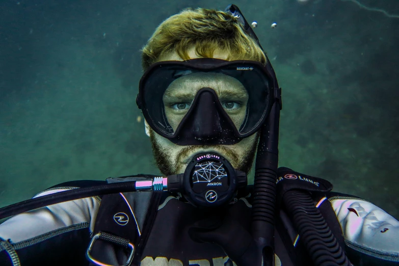 a man with diving gear on in the water