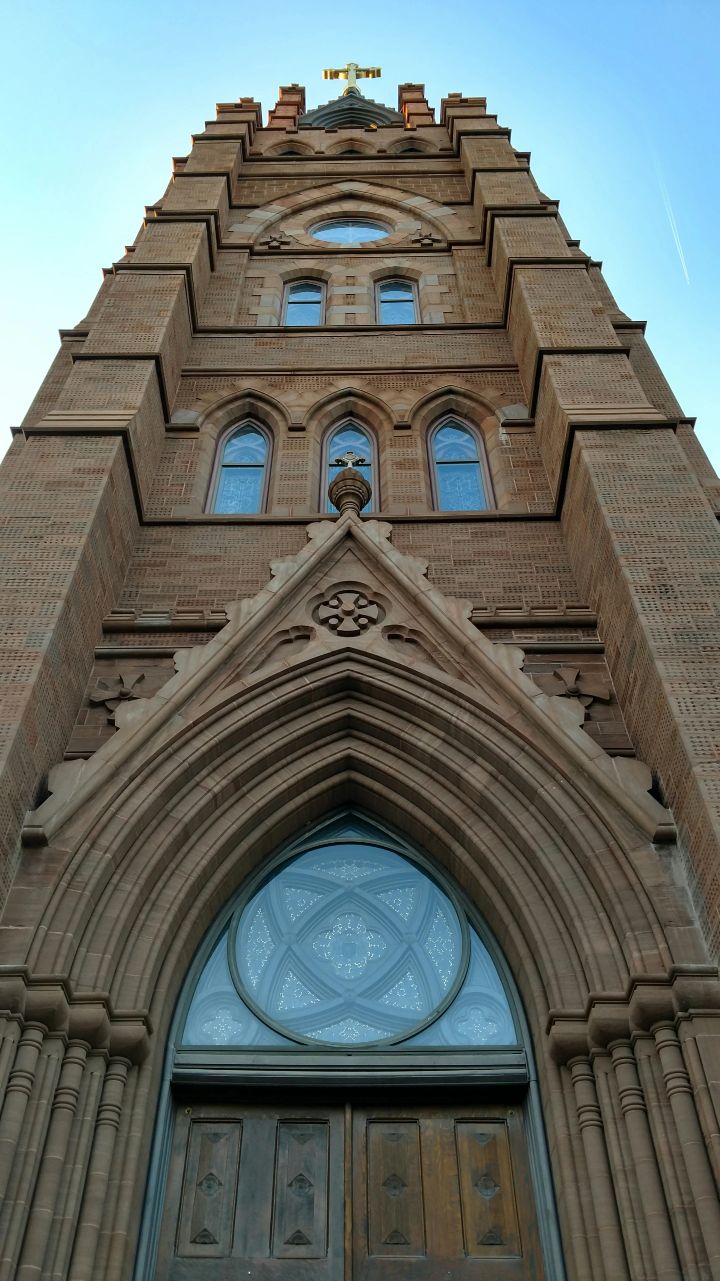 the door to an elaborate and large brick building