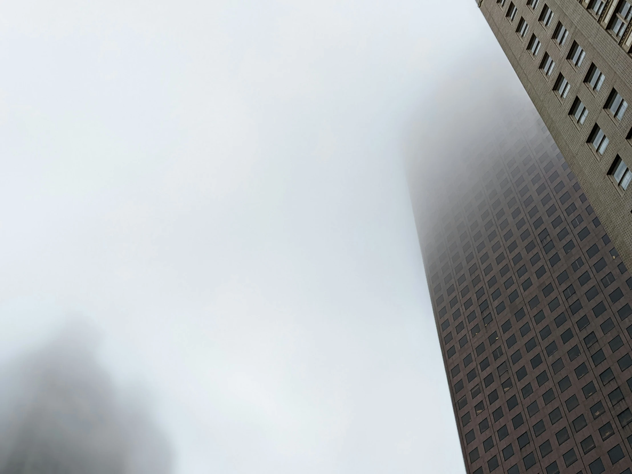 foggy building with skyscrs on a foggy day