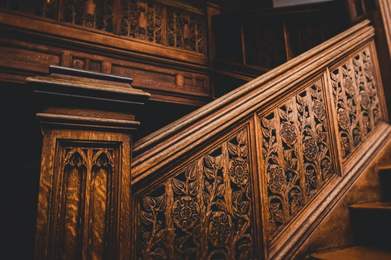 some stairs made of wood with intricate carvings