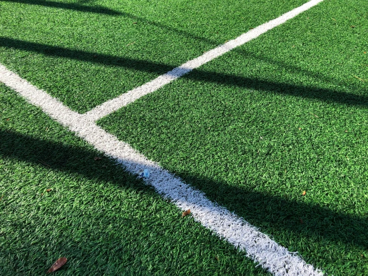 a shadow of a ball on the field