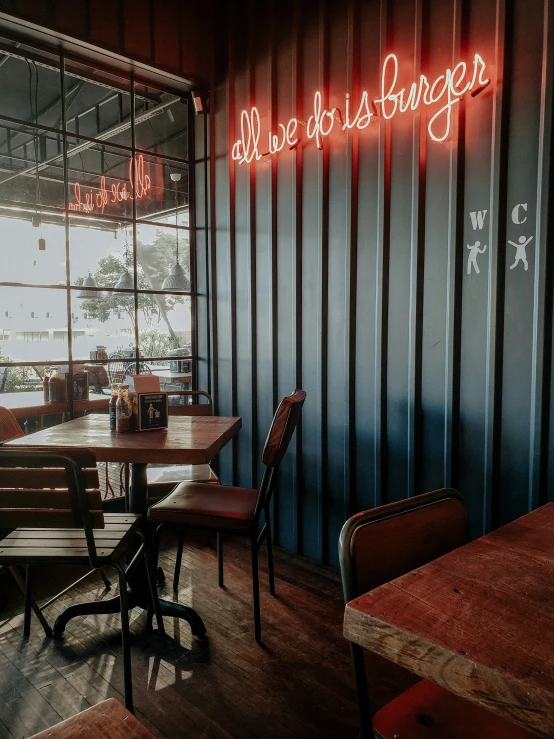 red neon lit sign on the wall of a restaurant