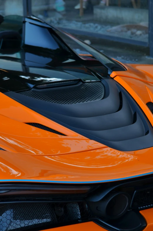 a orange car is pictured with black accents