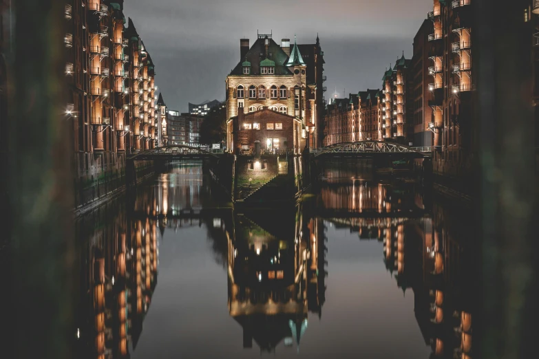 a river next to a group of tall buildings