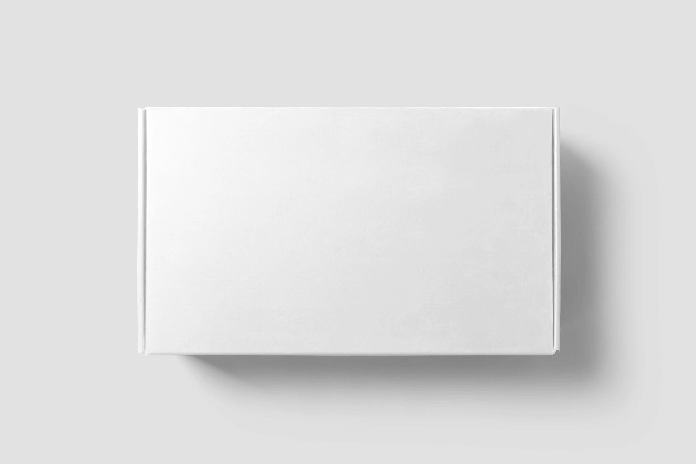 a white square box sitting on top of a wall