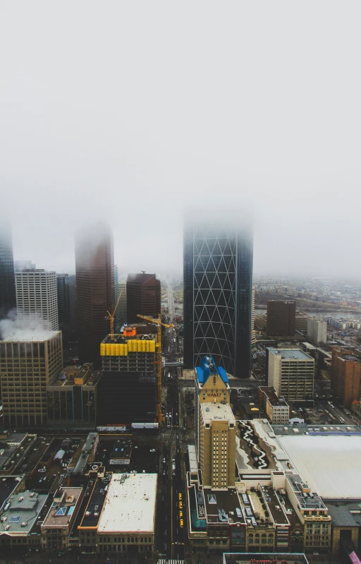 the view from a tall building in the fog, of a large city