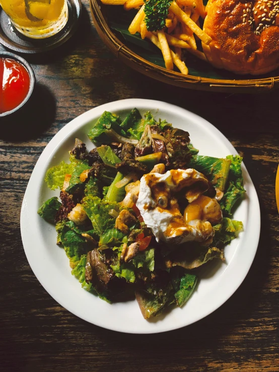 a plate full of food on a wooden table