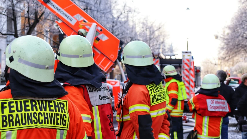 a group of construction workers in the snow