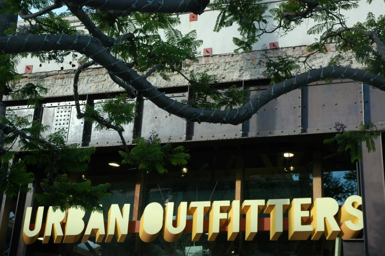 the words urban outfitters painted on an open store