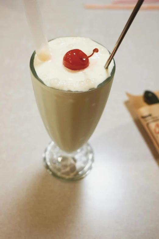 a close up of a dessert in a glass