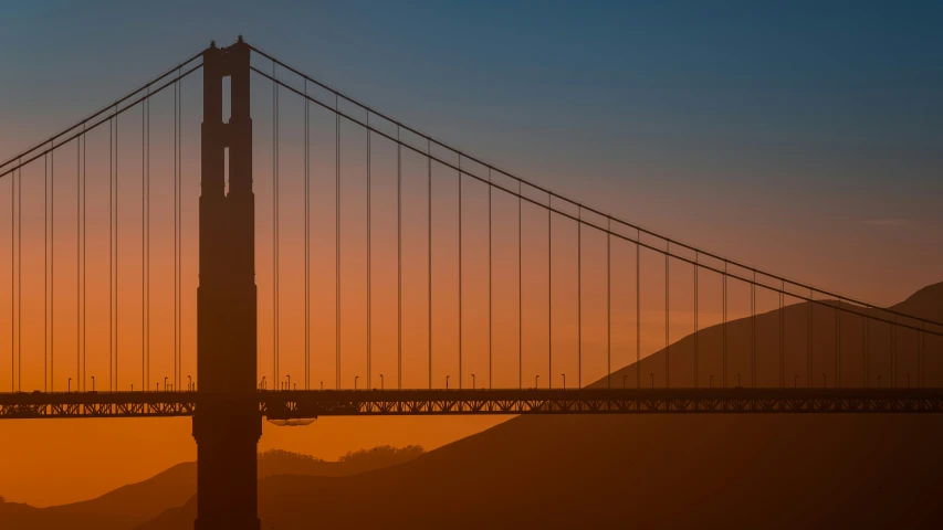 an airplane flying over the golden gate bridge