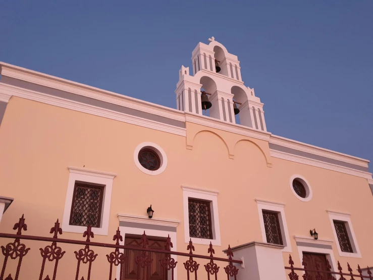 the steeple and arched windows of an old church