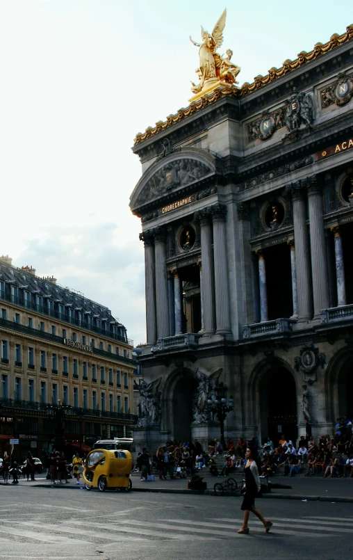 a large building with statues on top of it