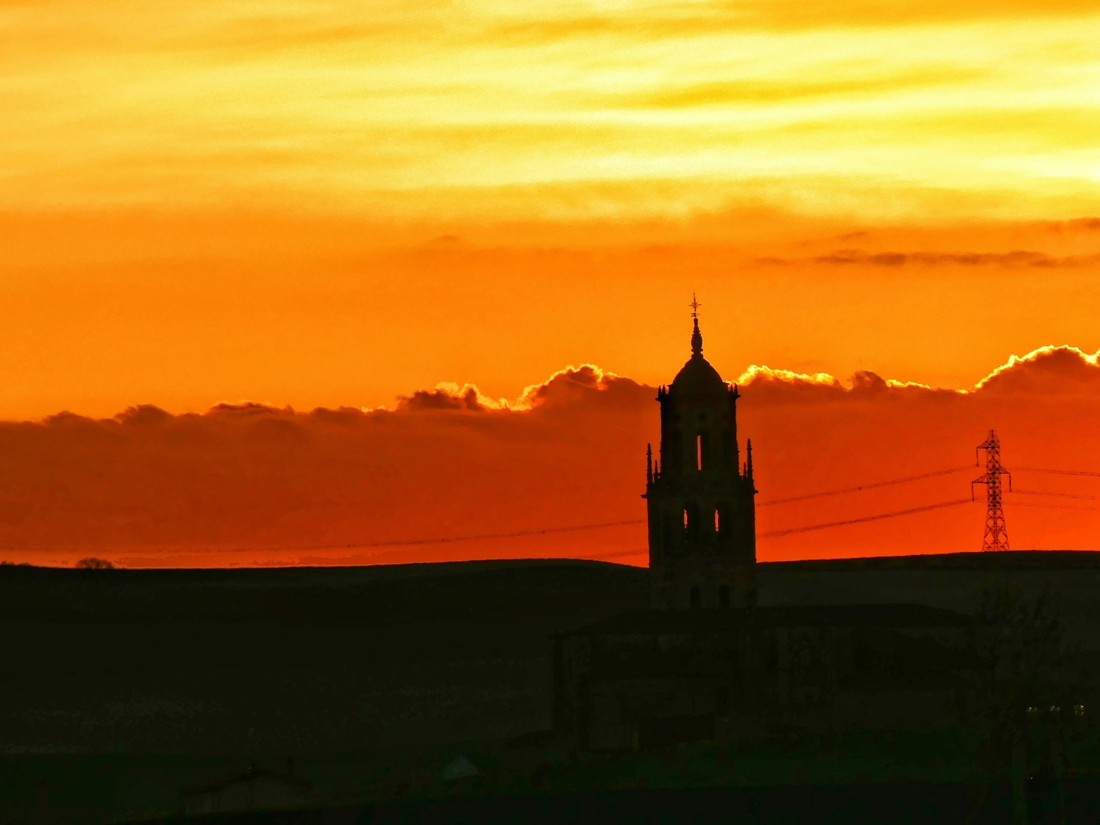 the tower is set against the sunset sky