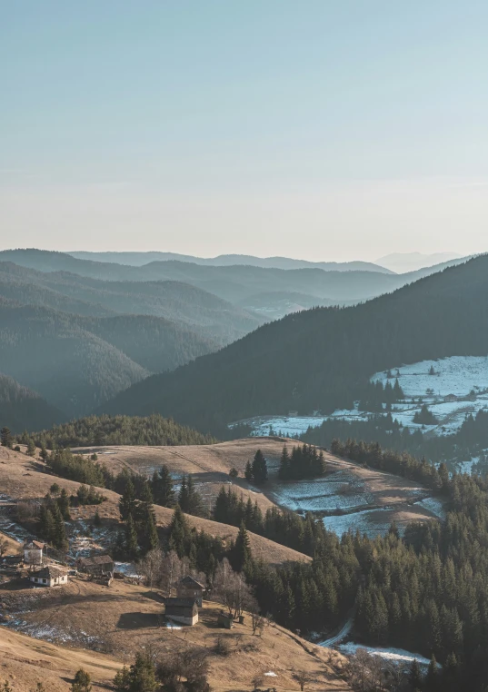 a distant view of an area with mountains, and a body of water