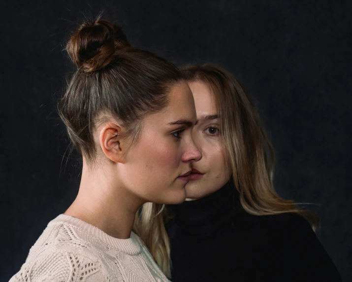 a couple of women standing next to each other