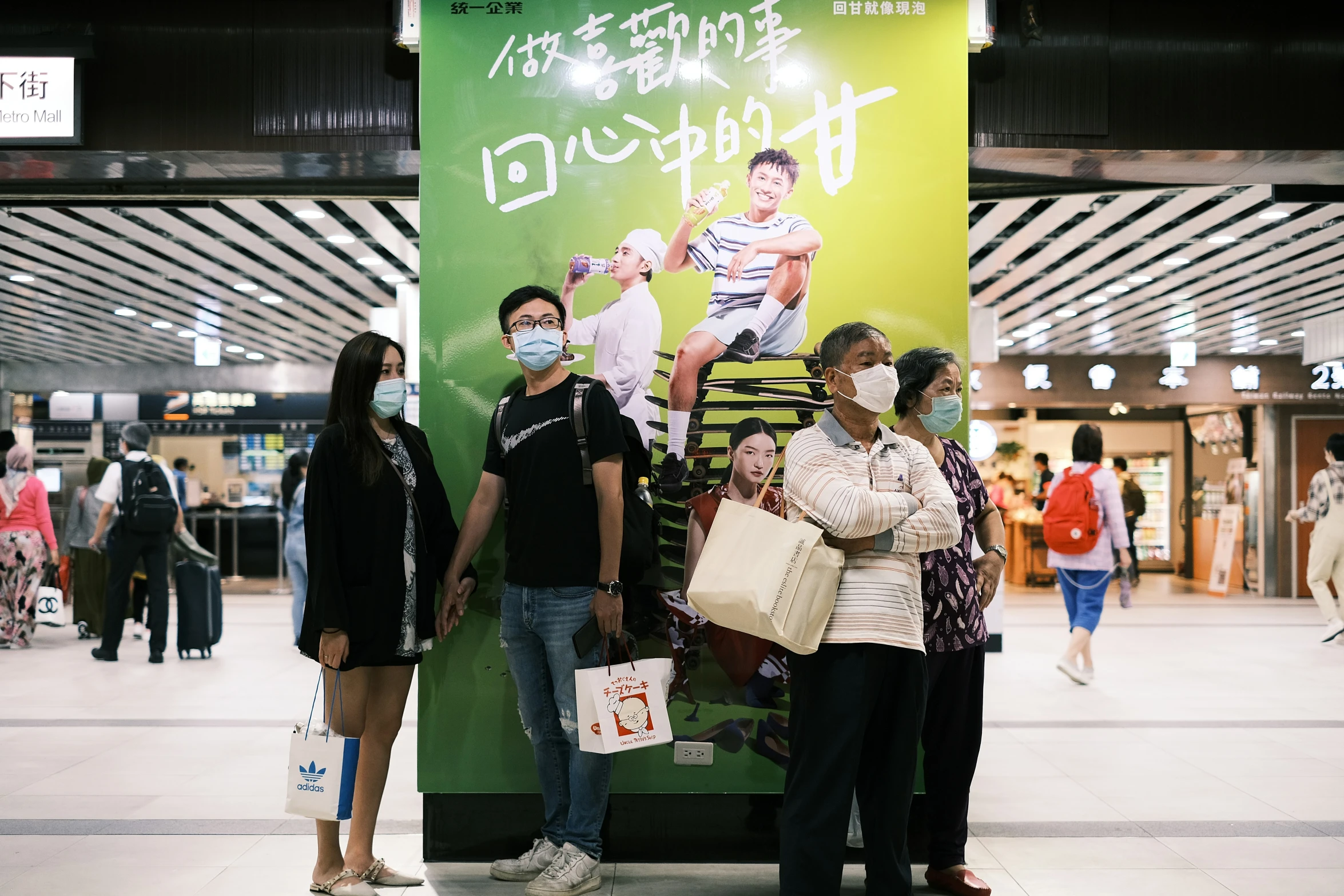 people are waiting for the train to arrive in japan